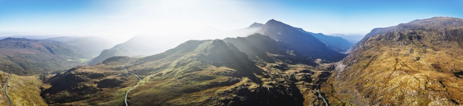 Autumn colours of Pen-y-Pass over Miner's Track, Start Point and road A4086 from a drone,