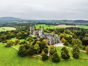 Autumn colours over Penrhyn Castle and Garden from a drone, Llandygai, Bangor, Gwynedd, North
