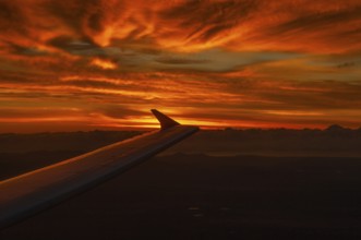 View from airplane window at sunrise