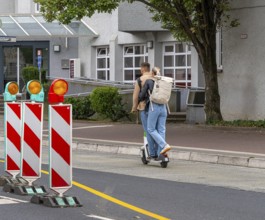 Electric scooters and rental bikes on public roads, Berlin, Germany