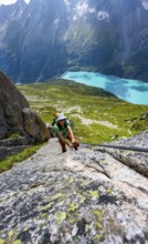 Mountaineer climbs on the secured Schijen-Zwärg via ferrata, climb to Bergseehütte, Göscheneralp in
