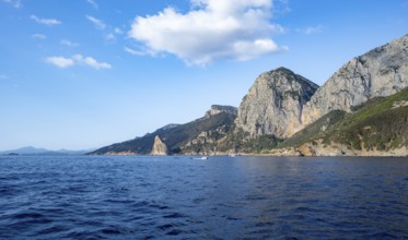 Picturesque rocky coast, cliffs with Pedra Longa pinnacle, blue sea, Golfo di Orosei, Baunei,