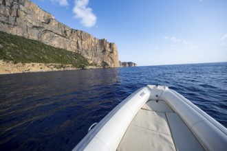 Motorboat trip along the picturesque rocky coast, cliffs and blue sea, Golfo di Orosei, Baunei,