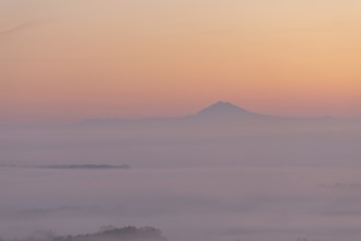 Hohenstaufen in the golden morning light, Aichelberg. Spectacular dawn over the foggy foothills of