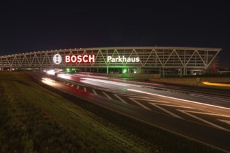 Night view of the A8 with traces of light at the P20 Messe car park, Airport, Stuttgart Germany