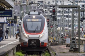 Platform in Stuttgart main station with regional train, overhead lines and track apron. Stuttgart,