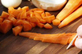 Southern German cuisine, preparing vegetables, cutting raw carrots, celery, onions, vegetarian,