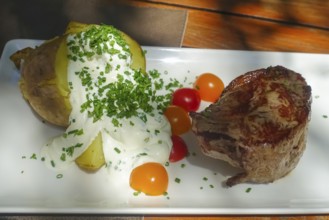Rump steak, slice of beef, baked potato with quark, herbs, cherry tomatoes, chives, food