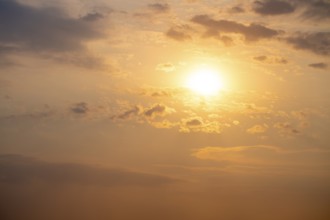 Dramatic sunset with clouds and sun, Etosha National Park, Namibia