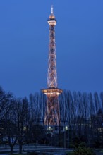 Red illuminated Berlin radio tower, half-timbered steel building by architect Heinrich Straumer,