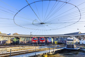 Turntable and overhead line spider, behind it modern locomotives of the Austrian Federal Railways,