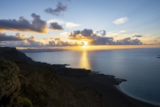 View of steep cliffs on sea and coast, Mirador del Porrito viewpoint at sunset, Lanzarote, Canary