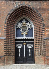 Portal of St. Nicholas Church, important building of North German brick Gothic and part of the