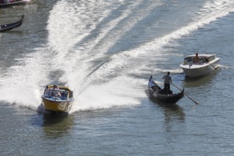 Ambulance boat in action on the Grand Canal, Rialto, Venice, Veneto, Italy