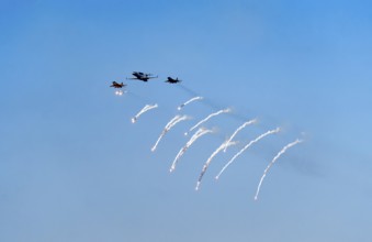 The Indian Air Force aerobatic team performs during an air show as part of the 93rd Air Force Day