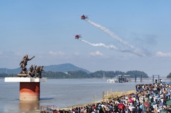 Indian Air Force (IAF) ALH Mk1 Sarang helicopters soar through the sky during an air show as part