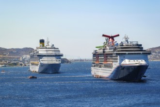 Mykonos, Cyclades, Greece - cruise ships CARNIVAL MIRACLE and COSTA FORTUNA are located in the bay