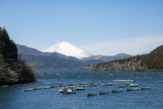 Attached rowing boats, view of Lake Ashi with Mount Fuji volcano, Hakone, Japan