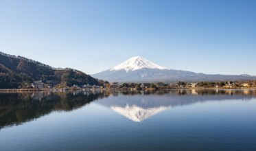 Volcano Mt. Fuji is reflected in Lake Kawaguchi, Yamanashi Prefecture, Japan