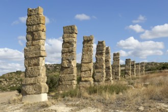 Stone columns of ancient aqueduct, Roman site of Los Banales, near Layana, Zaragoza province,