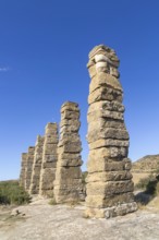 Stone columns of ancient aqueduct, Roman site of Los Banales, near Layana, Zaragoza province,