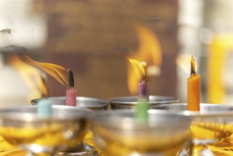 Oil lamps lit by believers as a symbol of the light of wisdom (the light dispels darkness and