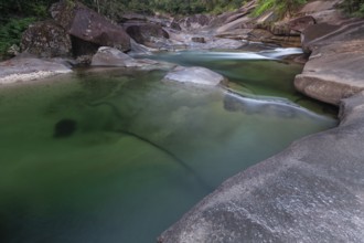 Turquoise blue water between rocks in the tropical rainforest of Babinda Boulders Queensland
