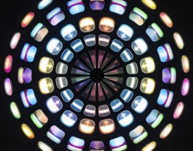 Abstract background of slightly unfocused multicolored glass lenses spinning and rotating,