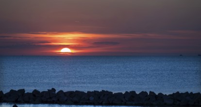 Sunset on the Baltic Sea with protective breakwaters, Darß, Ahrenshoop, Mecklenburg-Western