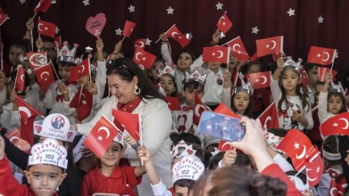 Children celebrate the 102nd anniversary of the Republic Day of Turkey, a national holiday