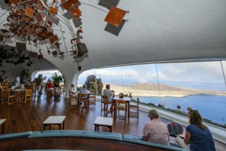 Interior of café with panoramic window in building designed by Cesar Manrique with the