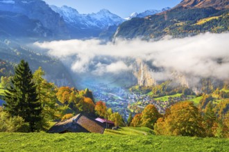 View from the village of the Lauterbrunnen Valley with Staubbach waterfall in autumn with morning