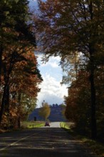 Car Road in autumn, autumn leaves, Germany