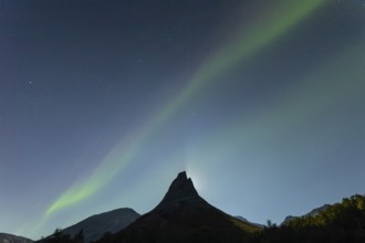 National mountain of Norway - Stetind in the Nordland under auroras and a full moon