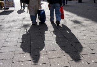 Shadows of passers-by shopping in the city center, Essen, North Rhine-Westphalia