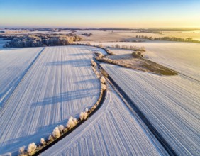 Bird Eye Perspective of Frost Covered Farmland. Seasonal Agricultural Scenery, winter and autumn