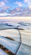Bird Eye Perspective of Frost Covered Farmland. Seasonal Agricultural Scenery, winter and autumn