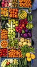 Fresh fruits and vegetables in a market display, aerial view perpendicular top down, healthy eating