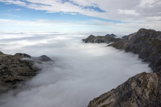 View from the Nebelhorn summit to mountains of the Allgäu Alps, mountains rising from fog in the