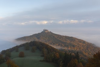 Hohenzollern Castle in a sea of fog at sunrise, autumn in the Swabian Jura