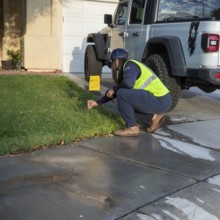 Las Vegas, Nevada - Devyn Choltko, a water waste investigator, patrols a residential neighborhood