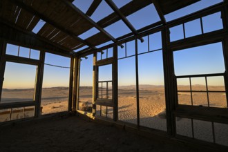 View from a former dwelling house into the desert, Kolmanskop, restricted diamond area, Karas