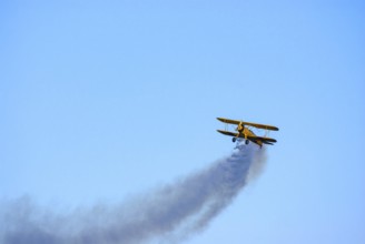 A Boeing-Stearman biplane during a flight demonstration as part of an air show at the Rossfeld in