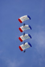 Parachutists during an aerial acrobatic demonstration as part of an air show on the Rossfeld in