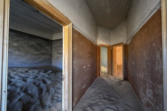 Sand mountains in a former dwelling house, interior photograph, Kolmanskop, restricted diamond