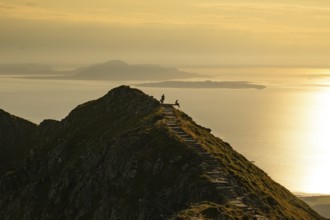Hikers on the Rørsethornet stone staircase, with 3292 steps one of the longest continuous stone