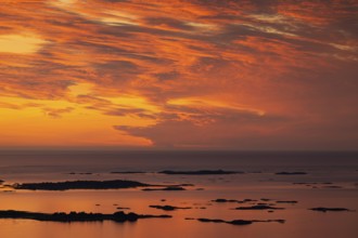 Offshore islands and skerries, sea, dramatically illuminated clouds, sunset, Otroya or Otrøya