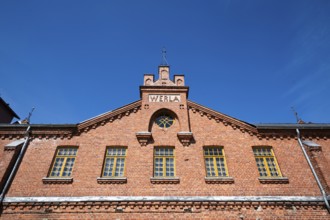Brick façade with inscription Werla, former paper factory and mill for the production of groundwood