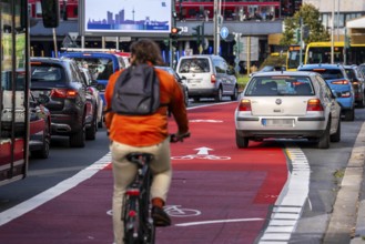 Cycle path, cycle lane, marked in red to draw the attention of motorists to the cycle path, between
