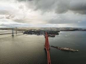 Forth Bridge from a drone, Queensferry Crossing, Forth Estuary, Scotland, United Kingdom